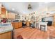 Open kitchen layout featuring light wood cabinets, modern appliances, and a breakfast bar for casual dining at 517 Carolina Ave, St Cloud, FL 34769