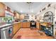Functional kitchen with light wood cabinets, stainless steel appliances, and ample counter space for cooking at 517 Carolina Ave, St Cloud, FL 34769