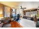 Bright and airy sunroom with relaxed seating, playful decor, and ample natural light at 517 Carolina Ave, St Cloud, FL 34769