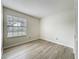 Neutral bedroom featuring a window and a closet with sliding doors at 5452 Higgins Way, Orlando, FL 32808