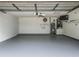 Spotless garage with a new paint, a ceiling fan, and essential utilities neatly organized at 5452 Higgins Way, Orlando, FL 32808