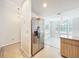 Bright kitchen featuring stainless steel refrigerator and tile flooring at 5452 Higgins Way, Orlando, FL 32808