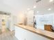 Bright kitchen with a breakfast bar overlooking the dining area with stainless steel appliances at 5452 Higgins Way, Orlando, FL 32808