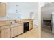 Functional kitchen with stainless steel refrigerator, wood cabinets, and tiled floors at 5452 Higgins Way, Orlando, FL 32808
