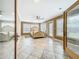 Spacious main bedroom boasts neutral walls, tile floors and multiple windows for natural light at 5452 Higgins Way, Orlando, FL 32808