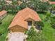 Charming home with a tile roof, screened entryway, and meticulous landscaping at 572 Sienna Dr, Poinciana, FL 34759