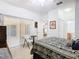 Bedroom with natural light, sliding glass doors, and a decorative bed with floral patterns at 572 Sienna Dr, Poinciana, FL 34759