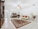 Open layout connects living and dining areas, featuring tile floors, and natural light, perfect for entertaining at 572 Sienna Dr, Poinciana, FL 34759