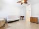 Bright and airy living room with tile flooring, ceiling fan, and ample natural light at 572 Sienna Dr, Poinciana, FL 34759