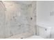 Bathroom with marble shower and new toilet at 600 Regency Way, Kissimmee, FL 34758