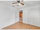 Bedroom with laminate flooring, and a large double-door closet at 600 Regency Way, Kissimmee, FL 34758
