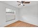 Bedroom with laminate flooring, window and ceiling fan at 600 Regency Way, Kissimmee, FL 34758