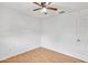 A simple bedroom with clean, white walls and a ceiling fan at 600 Regency Way, Kissimmee, FL 34758