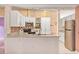 Well-equipped kitchen featuring stainless steel appliances, tiled backsplash, and ample cabinet space at 600 Regency Way, Kissimmee, FL 34758