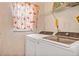 Laundry room with a washer and dryer, featuring a window at 600 Regency Way, Kissimmee, FL 34758