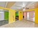 Large living room with tiled floors, bright walls, and entry to other living spaces at 600 Regency Way, Kissimmee, FL 34758