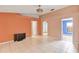 Open-concept living room with tile floors and neutral walls leading to bedrooms and other living spaces at 600 Regency Way, Kissimmee, FL 34758