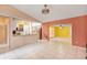 Open concept living space with breakfast bar, tile floor, and neutral tones at 600 Regency Way, Kissimmee, FL 34758