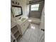 Bathroom featuring tiled floors, vanity sink, and a bathtub with modern tile at 702 Michigan Ct # 4, St Cloud, FL 34769