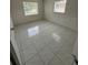 Bright bedroom with tiled floor and natural light, offering a peaceful living space at 702 Michigan Ct # 4, St Cloud, FL 34769