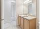 This bathroom features a vanity with a stone countertop and tile floors at 726 Irvine Ranch Rd, Kissimmee, FL 34759
