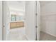 Bathroom with double vanity, glass shower, and a view to the closet at 726 Irvine Ranch Rd, Kissimmee, FL 34759