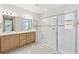 Bright bathroom with a glass enclosed shower and double sink vanity at 726 Irvine Ranch Rd, Kissimmee, FL 34759