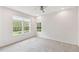 Cozy bedroom with large windows and neutral carpet, providing natural light at 726 Irvine Ranch Rd, Kissimmee, FL 34759