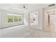 Spacious main bedroom with tray ceiling and large windows, filled with natural light at 726 Irvine Ranch Rd, Kissimmee, FL 34759