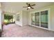 Covered screened patio area features brick floors, large windows, and access to the home's interior at 726 Irvine Ranch Rd, Kissimmee, FL 34759