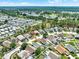 A picturesque aerial view of a residential area with houses nestled among mature trees and manicured lawns at 737 Oxford Dr, Davenport, FL 33897