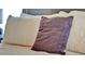 Close-up of a plush bed adorned with decorative pillows and a patterned white comforter at 737 Oxford Dr, Davenport, FL 33897