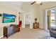Open living room with tile floors, backyard views, and television for entertainment at 737 Oxford Dr, Davenport, FL 33897
