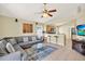 Cozy living room with a view of the kitchen and bar seating, great for entertaining guests at 737 Oxford Dr, Davenport, FL 33897