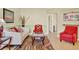 Bright living room with high ceilings, wood floors, stylish furniture, and a formal dining area at 737 Oxford Dr, Davenport, FL 33897