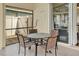 Cozy outdoor patio area furnished with a round table and four chairs, ideal for enjoying meals and conversation at 737 Oxford Dr, Davenport, FL 33897