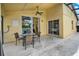 Outdoor patio featuring dining table and chairs with sliding glass doors to the interior; an ideal place for outdoor dining at 737 Oxford Dr, Davenport, FL 33897