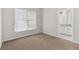 Bedroom with carpet floors, view of ensuite bathroom with granite countertop and ample natural light at 7554 Sunflower Cir, Kissimmee, FL 34747