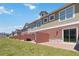 Exterior view of townhomes with red brick patio, and green space at 7554 Sunflower Cir, Kissimmee, FL 34747