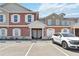 Inviting townhome exterior with guest parking and a well maintained landscaped entry at 7554 Sunflower Cir, Kissimmee, FL 34747