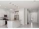 Open kitchen with granite counters, stainless appliances, and a center island at 7554 Sunflower Cir, Kissimmee, FL 34747