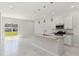 Open kitchen with granite counters, stainless appliances, and a center island at 7554 Sunflower Cir, Kissimmee, FL 34747