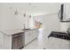Bright kitchen boasts granite countertops, stainless steel appliances, and eat in kitchen space at 7554 Sunflower Cir, Kissimmee, FL 34747