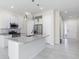 Bright kitchen features granite countertops, stainless appliances, and center island at 7554 Sunflower Cir, Kissimmee, FL 34747