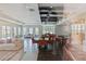 Spacious community center living area with tile and hardwood flooring, large windows, and modern furniture at 7554 Sunflower Cir, Kissimmee, FL 34747