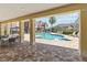 View of the community pool with covered seating area and lounge chairs for a relaxing day in the sun at 7554 Sunflower Cir, Kissimmee, FL 34747