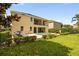 Expansive backyard with a pool, spa, patio, and lush green lawn, ideal for outdoor living and entertaining at 7616 Brookhurst Ln, Kissimmee, FL 34747