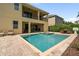 Spacious backyard featuring a pool, hot tub, patio furniture, and a lush landscaped yard perfect for Gathering time at 7616 Brookhurst Ln, Kissimmee, FL 34747