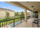 Relaxing balcony with a view of the pool and landscaped backyard, perfect for outdoor seating at 7616 Brookhurst Ln, Kissimmee, FL 34747