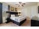 Comfortable bedroom with a luxurious upholstered headboard and stylish furnishings at 7616 Brookhurst Ln, Kissimmee, FL 34747